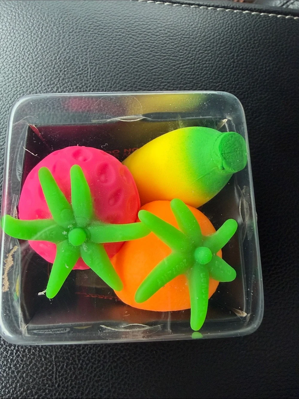 NeeDoh Groovy Fruit Squish Toys - Yellow Banana, Pink Strawberry, Orange Orange